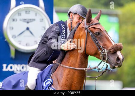 Hickstead, Sussex, UK. 27th July 2018. Winner. Kevin Jochems riding Captain Cooper. NED. The Longines BHS King George V Gold Cup. Prizegiving.  Longines FEI Jumping Nations Cup of Great Britain at the BHS Royal International Horse Show. All England Jumping Course. Hickstead. Great Britain. 27/07/2018. Credit: Sport In Pictures/Alamy Live News Stock Photo