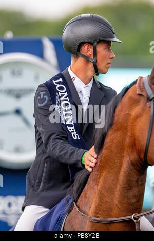 Hickstead, Sussex, UK. 27th July 2018. Winner. Kevin Jochems riding Captain Cooper. NED. The Longines BHS King George V Gold Cup. Prizegiving.  Longines FEI Jumping Nations Cup of Great Britain at the BHS Royal International Horse Show. All England Jumping Course. Hickstead. Great Britain. 27/07/2018. Credit: Sport In Pictures/Alamy Live News Stock Photo