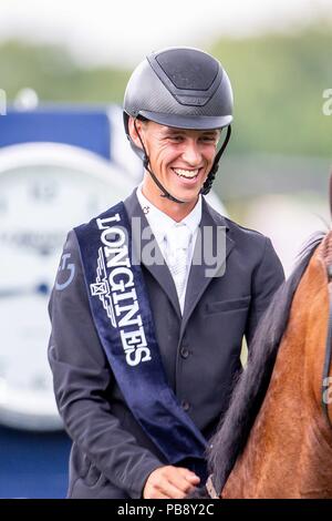 Hickstead, Sussex, UK. 27th July 2018. Winner. Kevin Jochems riding Captain Cooper. NED. The Longines BHS King George V Gold Cup. Prizegiving.  Longines FEI Jumping Nations Cup of Great Britain at the BHS Royal International Horse Show. All England Jumping Course. Hickstead. Great Britain. 27/07/2018. Credit: Sport In Pictures/Alamy Live News Stock Photo