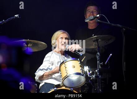 Mary Berry makes a surprise entance on drums and performs with Rick Astley Credit: Finnbarr Webster/Alamy Live News Stock Photo