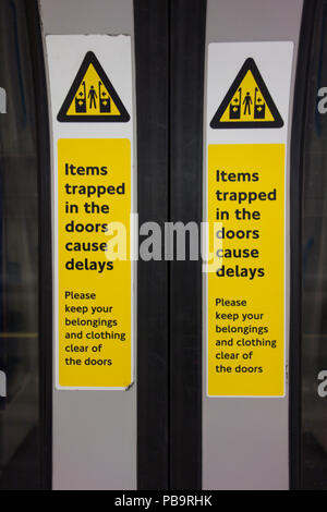 Mind the doors - closed doors on a London underground tube train Stock Photo