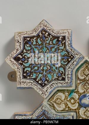 Eight-Pointed Star-Shaped Tile. Dimensions: Diam. 6 7/8 in. (17.5 cm)  Wt. (panel group) 31lbs. (14.1 kg). Date: 13th century.  Combining star- and cross-shaped luster tiles, this panel exemplifies the type of puzzle-like wall revetments popular in the Ilkhanid period.  Some of the tiles shown here display inscriptions from the Qur'an or verses of Persian poetry. Their content reveals that the tiles came from differing architectural contexts - some religious, others secular - and only later were combined to create this display. Museum: Metropolitan Museum of Art, New York, USA. Stock Photo