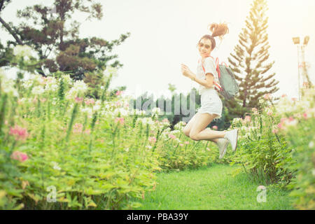 Girl cute teen life happiness jumping in the park outdoor Stock Photo