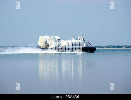 Isle of Wight hovercraft from Ryde to Southsea, UK on a calm summer's day reflected in the water , July 25th, 2018 Stock Photo