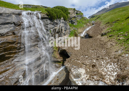 Picturesque Alpine waterfall at Grossglockner High Alpine Road in Austrian Alps Stock Photo