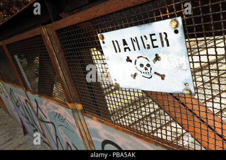 Road sign with the word danger on it Stock Photo