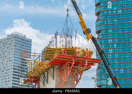 Engineers and construction workers are working on road construction bridge Stock Photo