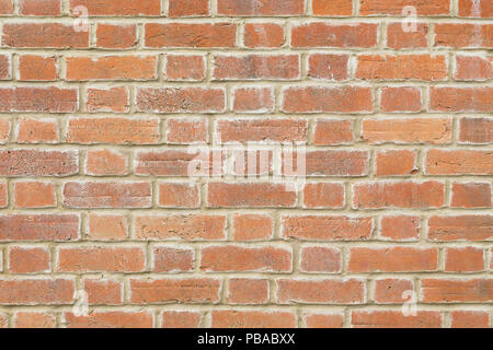 Red brick wall texture closeup pointed with lime mortar Stock Photo