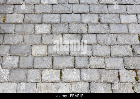 Weathered slate roof tiles background Stock Photo