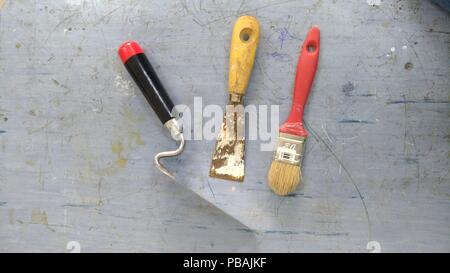 Used tools on a scraped table Stock Photo
