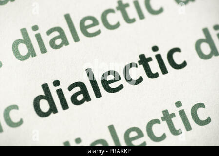 word dialectic printed on white paper macro Stock Photo