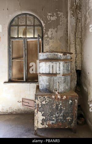 Ice factory boiler at Kolmankop, a ghost town in the Namib desert in southern Namibia, Stock Photo