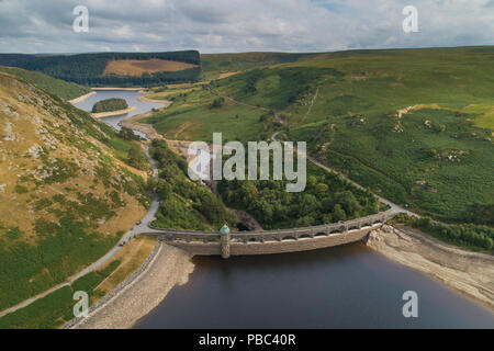 Aerial drone photograph of Craig Goch Dam and reservoir, in the Elan Valley, Powys, Mid Wales in July 2018, showing the low levels of the water following the long spell of dry weather. The Elan Valley system of dams and reservoirs supplies 133 billion litres of water a year via a pipeline to Birmingham Stock Photo