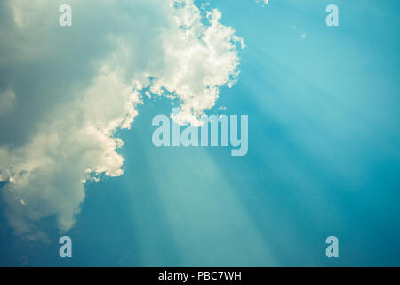 Sky with clouds and sun rays from the bottom Perfect Stock Photo