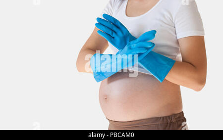 pregnant woman in the cleaning gloves isolated over white background Stock Photo