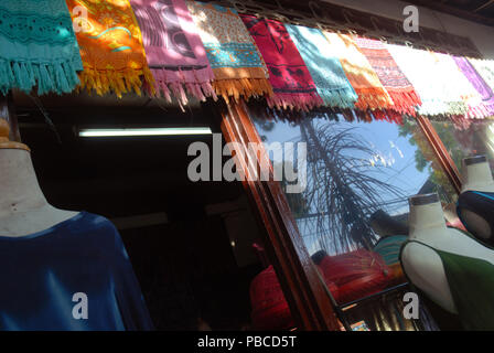 Clothes and scarfs on display outside shop, Ubud, Gianyar, Bali, Indonesia. Stock Photo