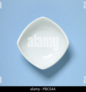 Light blue dish isolated on blue background Stock Photo