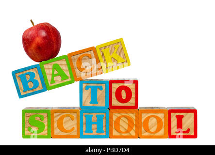 Back to School spelled out in wooden blocks with apple Stock Photo