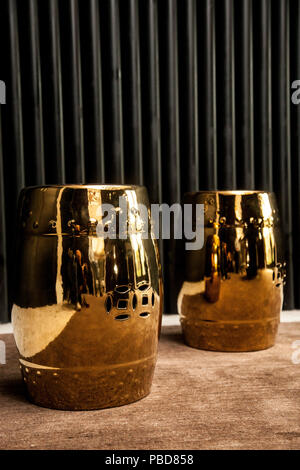 golden barrel in a livingroom on black background Stock Photo