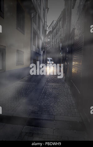 Foggy narrow street at dawn, Porto, Portugal Stock Photo