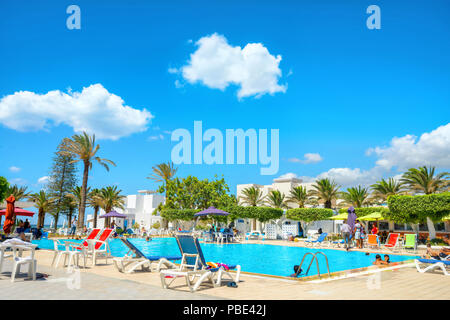 Courtyard with swimming pool of resort hotel on tunisian mediterranean seaside. Nabeul, Tunisia, North Africa Stock Photo