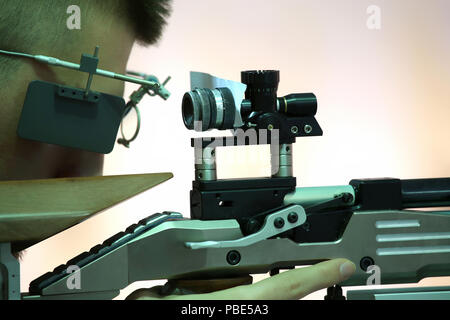 young man aiming a pneumatic air rifle Stock Photo