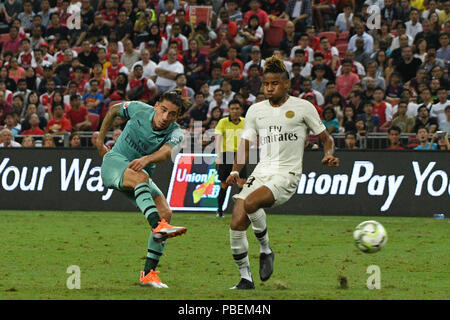 Singapore. 28th July, 2018. Arsenal's Hector Bellerin (L) shoots past Paris Saint-Germain's Christopher Nkunku during the International Champions Cup soccer match held in Singapore on July 28, 2018. Credit: Then Chih Wey/Xinhua/Alamy Live News Stock Photo