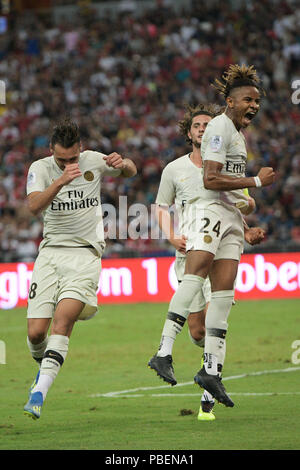 Singapore. 28th July, 2018. Paris Saint-Germain's Christopher Nkunku (R) celebrates after scoring a penalty kick during the International Champions Cup soccer match against Arsenal held in Singapore on July 28, 2018. Credit: Then Chih Wey/Xinhua/Alamy Live News Stock Photo