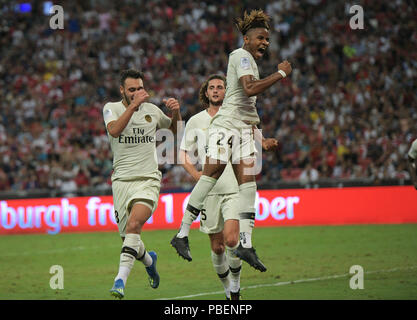Singapore. 28th July, 2018. Paris Saint-Germain's Christopher Nkunku (R) celebrates after scoring a penalty kick during the International Champions Cup soccer match against Arsenal held in Singapore on July 28, 2018. Credit: Then Chih Wey/Xinhua/Alamy Live News Stock Photo