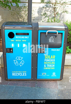 Solar powered recycling and trash compactor outside the Cleveland Public Library in downtown Cleveland, Ohio, USA. Stock Photo