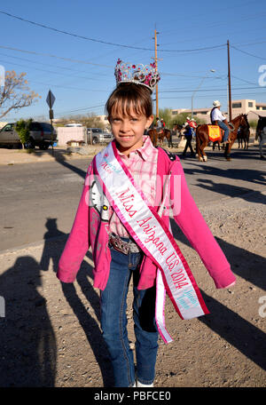 Gabriela Bustillos, 9, Miss Arizona in the Junior Tween Division, strikes a pose before joining the Tucson Rodeo Parade, the longest non-motorized par Stock Photo