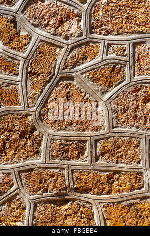 Cemented natural stone wall background Stock Photo