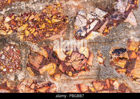 Cemented naural flint rough yellow stone wall background Stock Photo