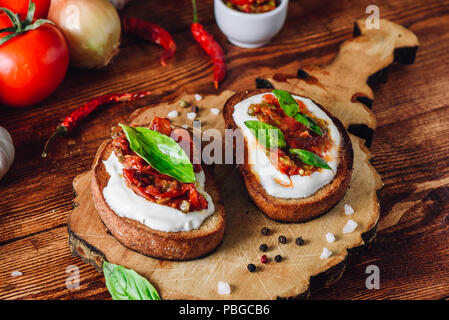 Two Bruschettas with Sundried Tomatoes and Spicy Sauce with Red Pepper Stock Photo