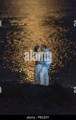 Bride and groom under the full moon, Bride and groom under the moon light Stock Photo