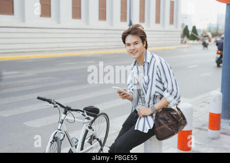 Successful businessman riding bicycle Stock Photo