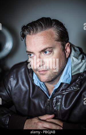 portrait of a handsome man in a leather jacket Stock Photo