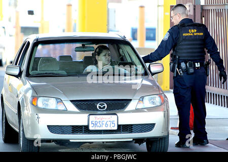 CBP field officer checks ID at the DeConcini Nogales Port of Entry. Stock Photo