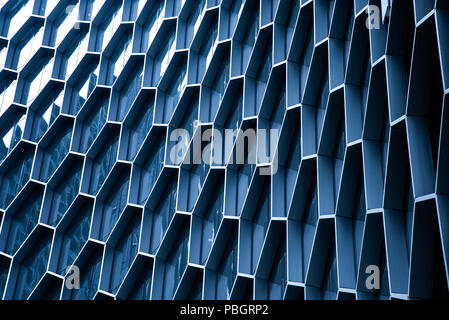 Modern hexagon glass windows on office building Stock Photo