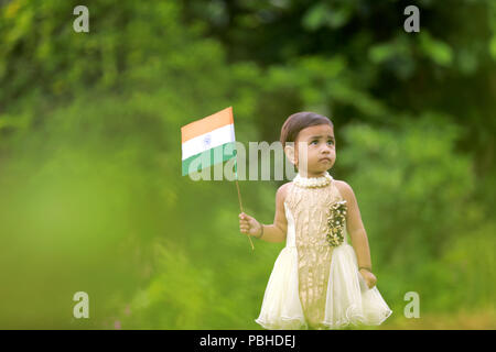 indian girl child holding indian flag Stock Photo