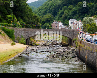 A39 Road bridge arches over the boulder strewn East Lyn river at Lynmouth, Devon, UK Stock Photo