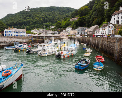 Mix of fishing and pleasure craft in the small harbour at Lynmouth, Devon, UK Stock Photo