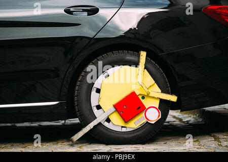 Wheel Of Car Was Locked With Yellow Clamped Wheel Lock By Traffic ...