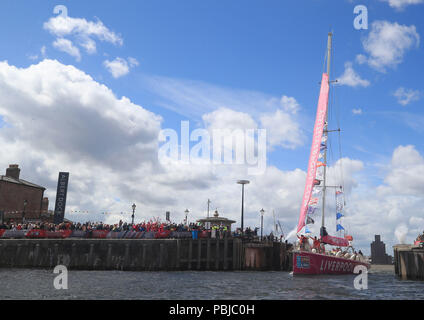 The Liverpool 2018 yacht enters the Royal Albert Dock in Liverpool after a 'sprint finish' to conclude the Clipper 2017-2018 Round the World Yacht Race. Stock Photo
