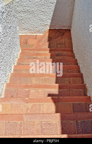 Outdoors Tiled staircase and textured wall from above Stock Photo