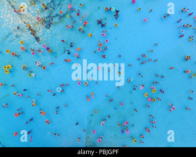 Nanjing, China. 27th July, 2018. Aerial photography of tourists at a water park in Nanjing, east China's Jiangsu Province. Many people flock to swimming pool for coolness during summer. Credit: SIPA ASIA/Pacific Press/Alamy Live News Stock Photo
