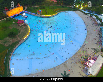 Nanjing, China. 27th July, 2018. Aerial photography of tourists at a water park in Nanjing, east China's Jiangsu Province. Many people flock to swimming pool for coolness during summer. Credit: SIPA ASIA/Pacific Press/Alamy Live News Stock Photo