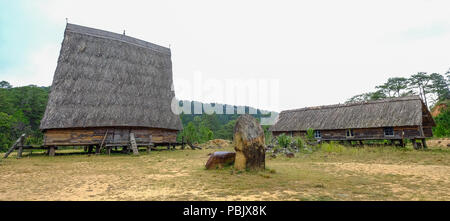 Traditional houses at an ethnic village in Central Highlands of Vietnam. Stock Photo