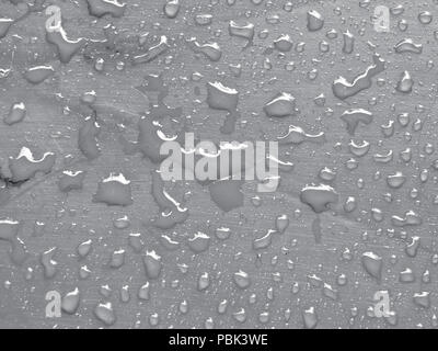 water drops on quiet gray colored metallic surface Stock Photo