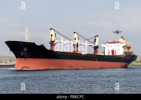 general cargo vessel shipping on canal Stock Photo